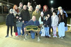 The Jim McDaid 80th Birthday Celebration Sprint winner Cals Storm pictured with winning owner Michael Calvert (kneeling), Jim McDaid is standing behind him they are surrounded by all Jim’s extended family. Photo by John Killen