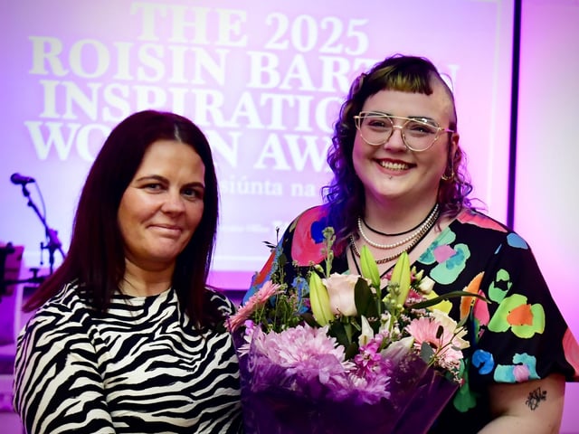 Aine McFadden receiving her presentation on behalf of her mother Anne Doherty, from Aine Doherty, daughter of Roisin Barton.