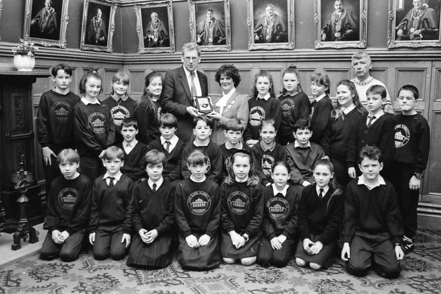 Pupils and staff of St Oliver Plunkett's PS, Strathfoyle, with the Mayor, Annie Courtney, in the Guildhall.