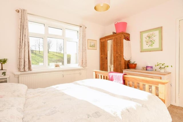 The second bedroom has a touch of elegance about it. With its carpeted floor and radiator, and space for a wardrobe, it has views facing the back of the property.