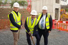 The Mayor of Derry & Strabane Ruairí McHugh cutting the first sod at the new Tillie & Henderson development. Also pictured is Mr Jim McShane, Chief Executive of Ark Housing Association
