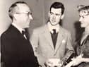 Fr Mullan pictured with his late mother as a young student of St Columb’s College receiving a prize for his historical studies.