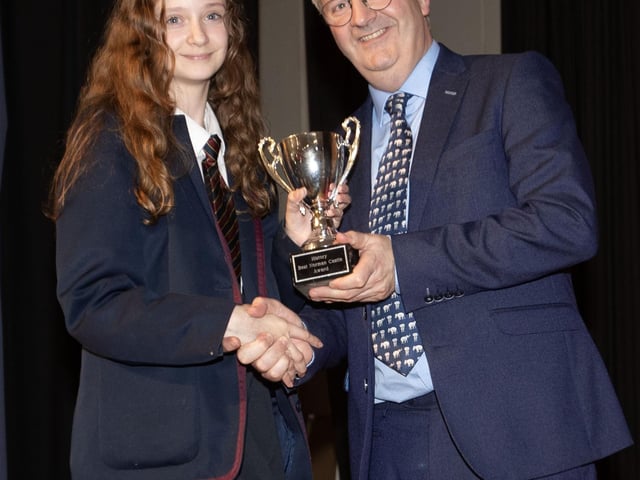 Mr. John Harkin, Principal, Oakgrove Integrated College, pictured presenting the History (Best Norman Castle) award to Isabelle.