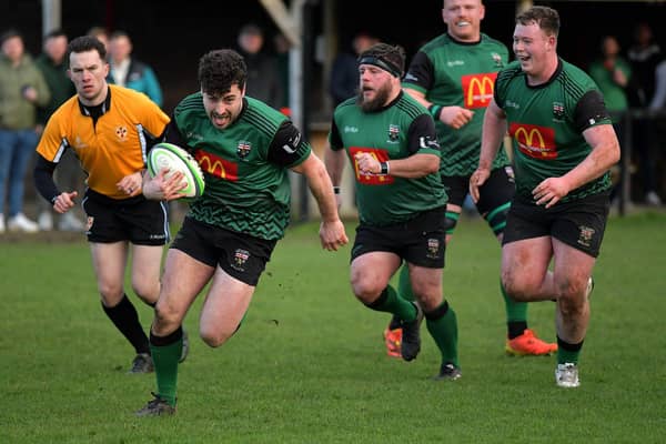 Alex McDonnell races to the line to score a try for City of Derry against Randlestown. Photo: George Sweeney