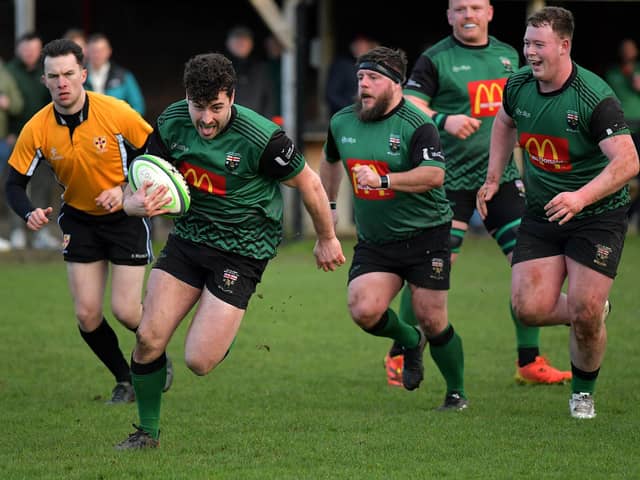 Alex McDonnell races to the line to score a try for City of Derry against Randlestown. Photo: George Sweeney
