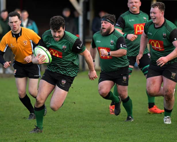 Alex McDonnell races to the line to score a try for City of Derry against Randlestown. Photo: George Sweeney
