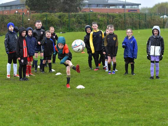 The inclement weather, on Tuesday, did not deter attendance at the Derry City Easter Soccer Camp at Broadbridge Primary School. Picture: George Sweeney. DER2315GS – 135