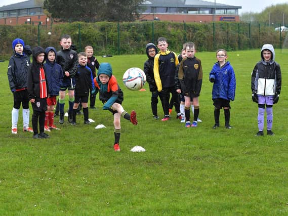 The inclement weather, on Tuesday, did not deter attendance at the Derry City Easter Soccer Camp at Broadbridge Primary School. Picture: George Sweeney. DER2315GS – 135