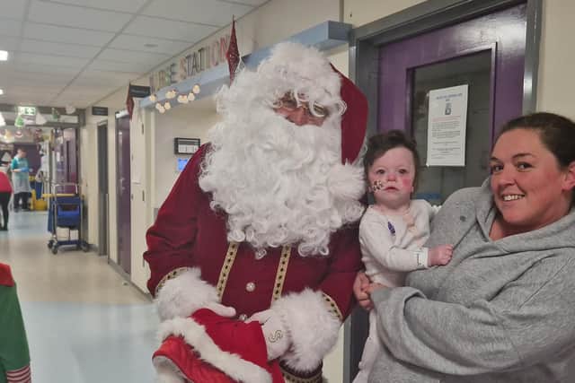 Santa Claus with Adle and Lexi Armstrong.
