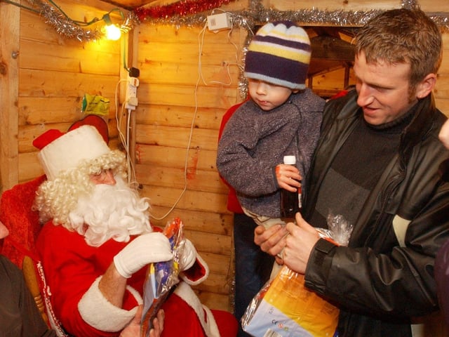 Andrew Steele and his son Dean visit Santa's Grotto. (0612PG69)                              : Christmas in Inishowen in 2005.