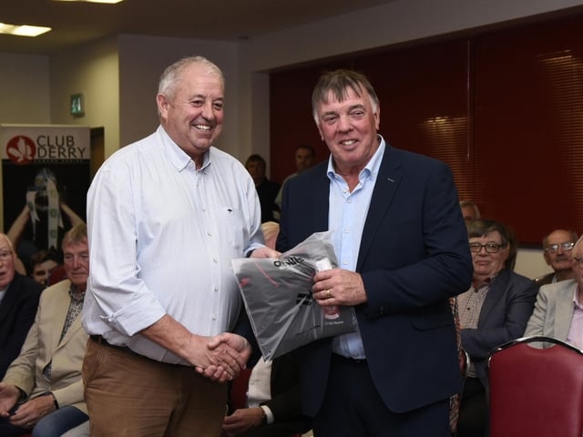 Derry Co. Chairman John Keenan makes a presentation to Micky Lynch at the 1975 / 76 Ulster SFC Winners reunion in Owenbeg on Friday.