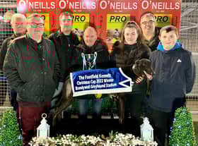 Kearney's Galaxy who won the Kevin O’Kane Sprint in 16.80 with (from left) Darren & Dean Toland, Johnny Carlin, Kealan O’Kane, Shane Talbot, Kevin O’Kane & Orla Wray.