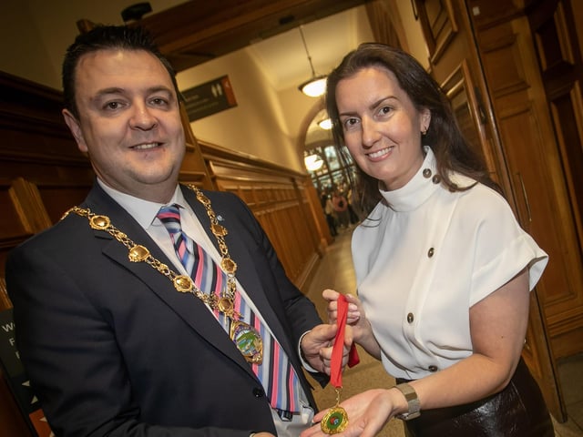 Foyle School of Speech and Drama teacher Blathnaid Biddle presenting the Mayor Ruairí McHugh with a special recognition award on Tuesday at the Guildhall.