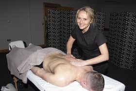 Body Massage Therapist Elaine Carlin hard at work on a client during Saturday’s Men’s Health Day in Creggan. Jim McCafferty Photography.