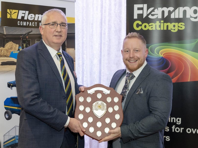 Jason Bell of Newbuildings receives the League Two batting award from Brian Dougherty at the NW Cricket presentation evening.