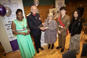 KING'S AWARD FOR VOLUNTARY SERVICE. . . . The Lord Lieutenant of the County Borough of Londonderry, Iain Crowe, MBE, CStJ, presents the King's Award for Voluntary Service to Roslyn McCorkell. On left is the Mayor, Lilian Seenoi-Barr, and on right, Sgt. Niall Downey, Irish Guards and Lynsey Hewitt. (Photos: Jim McCafferty Photography)