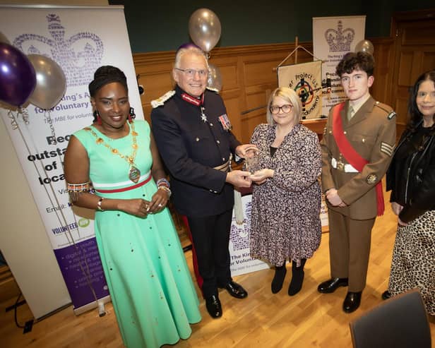 KING'S AWARD FOR VOLUNTARY SERVICE. . . . The Lord Lieutenant of the County Borough of Londonderry, Iain Crowe, MBE, CStJ, presents the King's Award for Voluntary Service to Roslyn McCorkell. On left is the Mayor, Lilian Seenoi-Barr, and on right, Sgt. Niall Downey, Irish Guards and Lynsey Hewitt. (Photos: Jim McCafferty Photography)