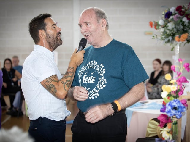 Micky Doherty and Willie Barrett celebrate with a duet on Tuesday in Creggan. (Photos: Jim McCafferty Photography) : .