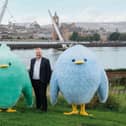 Share Energy CEO Damian Wilson and mascots.