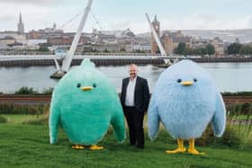 Share Energy CEO Damian Wilson and mascots.