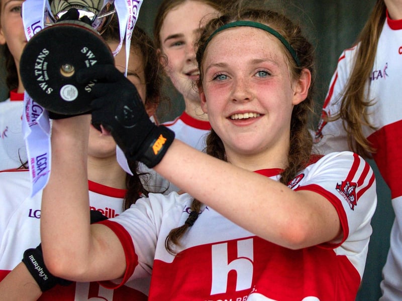 Derry captain Aine Young lifts the cup after the 2023 All-Ireland U14 Gold Final at Clan na Gael GAA Club in Dundalk, Louth. Photo by Stephen Marken/Sportsfile