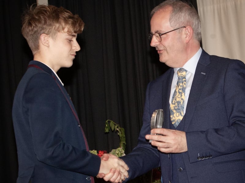 Mr. John Harkin, Principal, Oakgrove Integrated College presenting senior prizes to students.