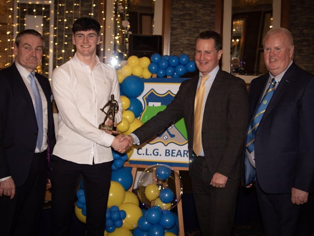 Aidan McKinney, Senior Hurling Young Player of the Year 2024, receives his trophy from Cormac Hartnett, Hurling Officer, GAA. Included on left is Ciaran McLaughlin, former Ulster President, GAA, and, on right, Liam Gallagher, Chair, Burt GAA. (Photos: Jim McCafferty Photography)