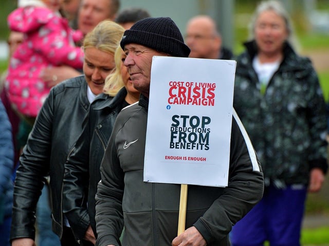 Protester with a placard at the Derry Against Fuel Poverty march and rally on Saturday afternoon last. Photo: George Sweeney. DER2239GS – 114