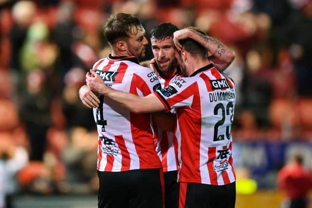 Derry City players, from left, Jamie Stott, Patrick McClean and Cameron Dummigan celebrate a clearance. Photo by Stephen McCarthy/Sportsfile