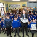 Minister Charlie McConalogue presents the Marine Institute’s Explorers National Ocean Champions Award to pupils of Scoil Cholmcille Primary School, Glengad.