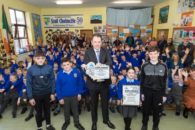Minister Charlie McConalogue presents the Marine Institute’s Explorers National Ocean Champions Award to pupils of Scoil Cholmcille Primary School, Glengad.