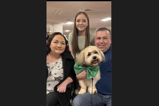 Olivia, pictured with her daughter, Lisa, husband Brendan and dog Buttons.