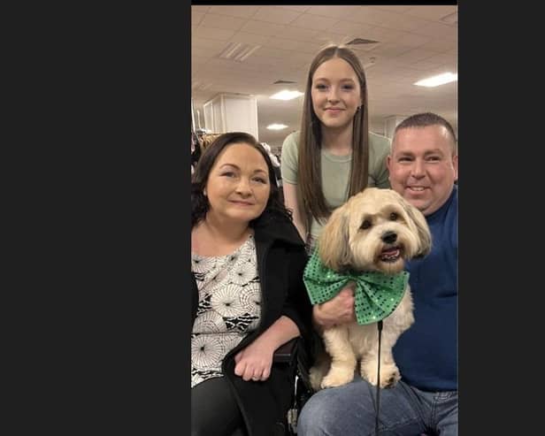 Olivia, pictured with her daughter, Lisa, husband Brendan and dog Buttons.