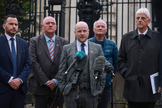 File photo dated 19/10/26 of the legal representative for Portadown District Lodge 101 and loyalist spokesperson, Jamie Bryson, speaking to the media, with Timothy Gaston MLA (left), outside Belfast High Court. (Liam McBurney/Press Association)