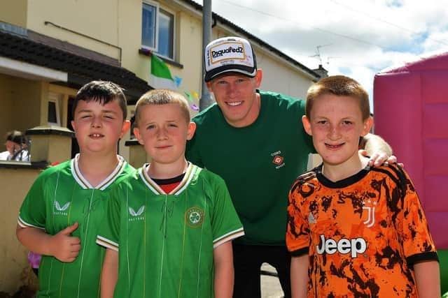 James McClean with young fans in Creggan.