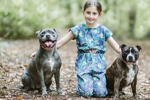 Grace with Molly and Luna. Photo: Pet Adoption Website.