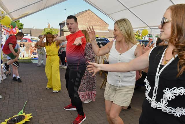 Enjoying the dancing and music at the Annual Farland Way Hazelbank Big Lunch. Photo: George Sweeney