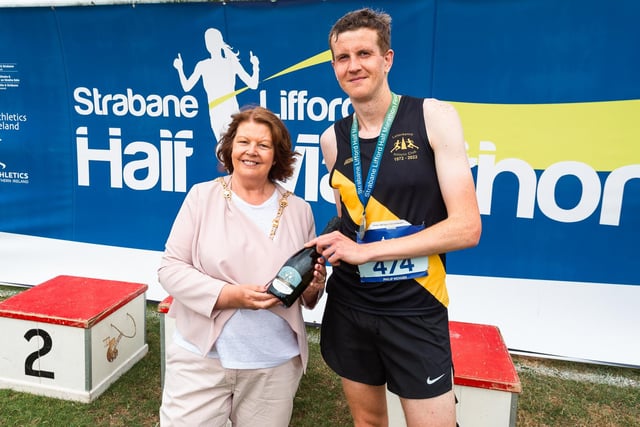 Mayor of Derry City and Strabane District Council, Councillor Patricia Logue with men's winner Philip McHugh of Letterkenny AC. (Photo: Karol McGonigle)