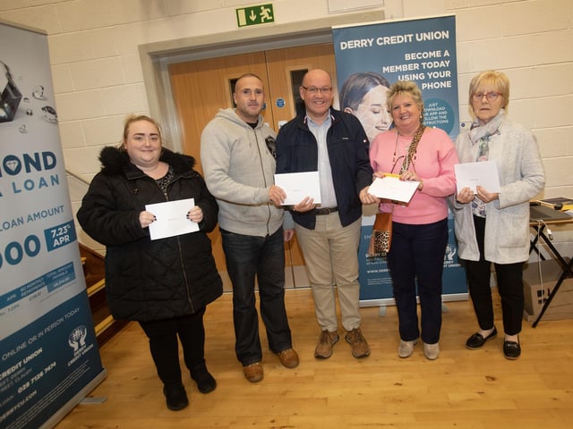Gerry McMonagle, Derry Credit Union, presenting £25 prizewinners at Monday's AGM. From left Ciara O'Reilly, Sean-Paul Brinkley, Frances Meenan and Grace McKenna. : .