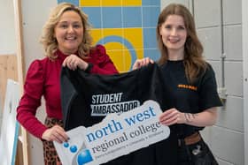 Rebecca Gavigan is presented with a NWRC hoodie by Senior Marketing and PR Officer Erin Hutcheon. (pic Martin McKeown)