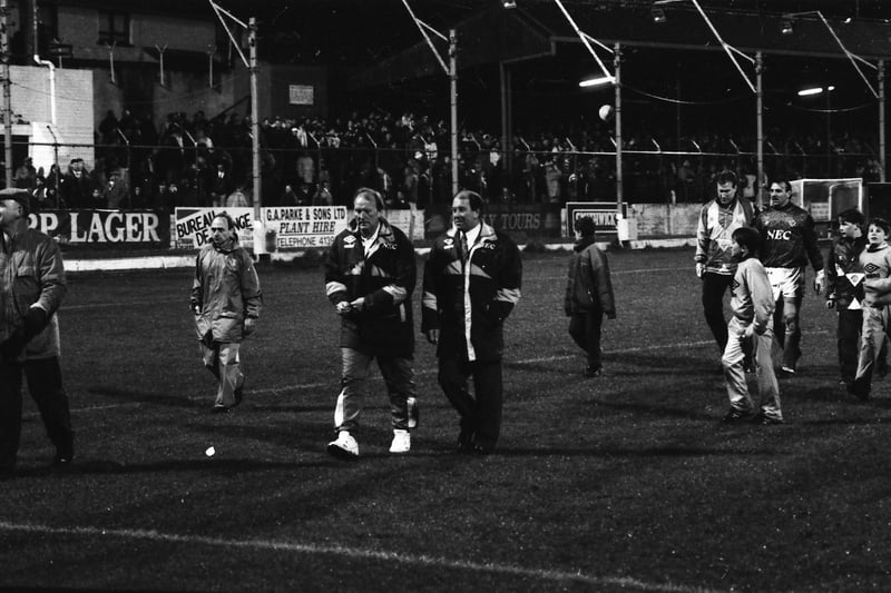 Everton manager Howard Kendall leads his players off the Brandywell turf.