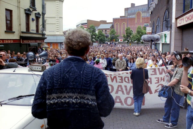 Martin McGuinness addresses protestors at Waterloo Street. Hugh Gallagher