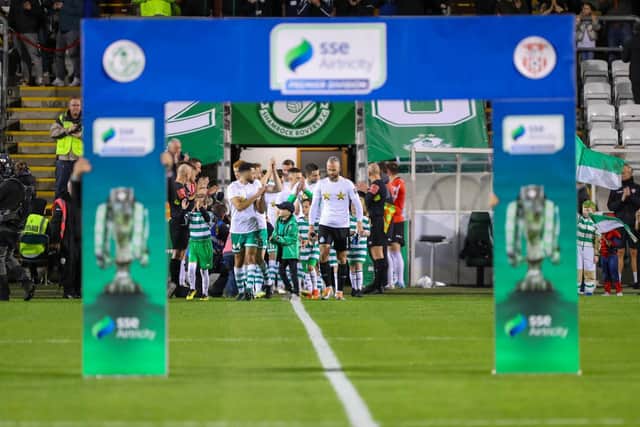 Derry City players perform the traditional guard of honour for champions Shamrock Rovers in the tunnel at Tallaght Stadium prior to kick-off on Sunday night. Photograph by Kevin Moore.