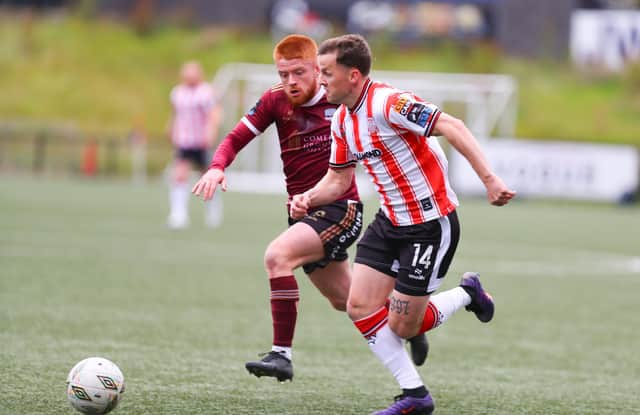 Derry City full back Ben Doherty races past Aodh Dervin of Galway last Friday night.