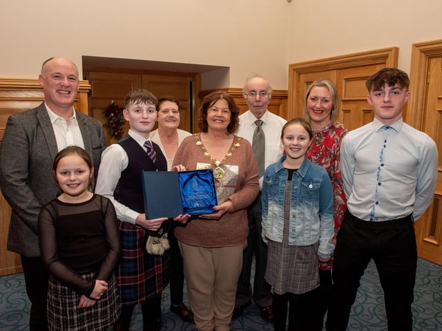 Twelve years old Jacob Laird from Bready Ulster Scots Pipe Band has been recognised by the Mayor Councillor Patricia Logue after he was crowned Ulster, All Ireland and World Champion solo snare drum champion. Pictured with Jacob are his mum and dad, Tanya and Ivor and grand parents Ann and Kenneth Scott and sisters Eve and Zara and brother Zac. Picture Martin McKeown.