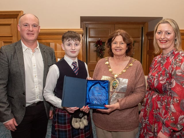 Twelve years old Jacob Laird from Bready Ulster Scots Pipe Band has been recognised by the Mayor Councillor Patricia Logue after he was crowned Ulster, All Ireland and World Champion solo snare drum champion. Pictured with Jacob are his mum and dad, Tanya and Ivor. Picture Martin McKeown.