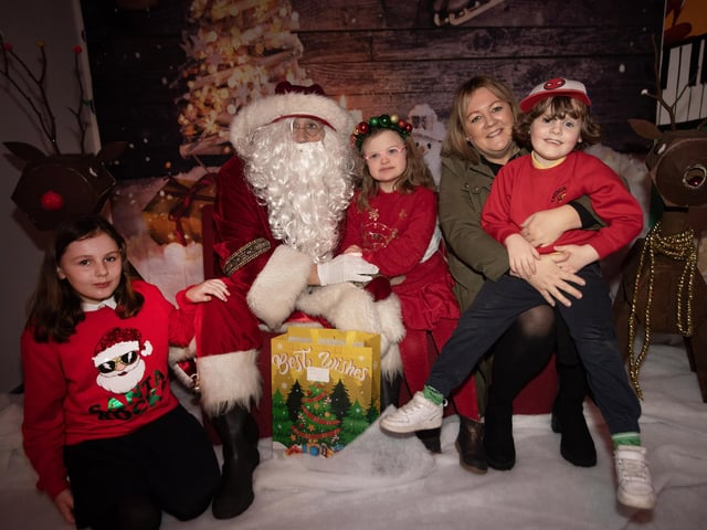 Smiles all round as Lola and her family meet Santa