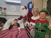 Ten year old Jake Colgan with Mr and Mrs Claus.