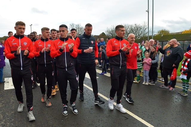 Derry City players and staff greet fans gathered at Brandywell Stadium on Saturday morning prior to their departure for Dublin ahead of tomorrow’s FAI Cup Final against Shelbourne. George Sweeney.  DER2244GS – 46