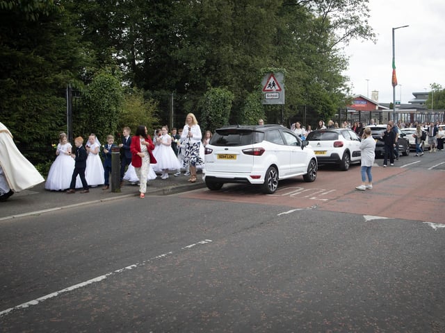 The procession makes its way across Central Drive, Creggan on Thursday morning.